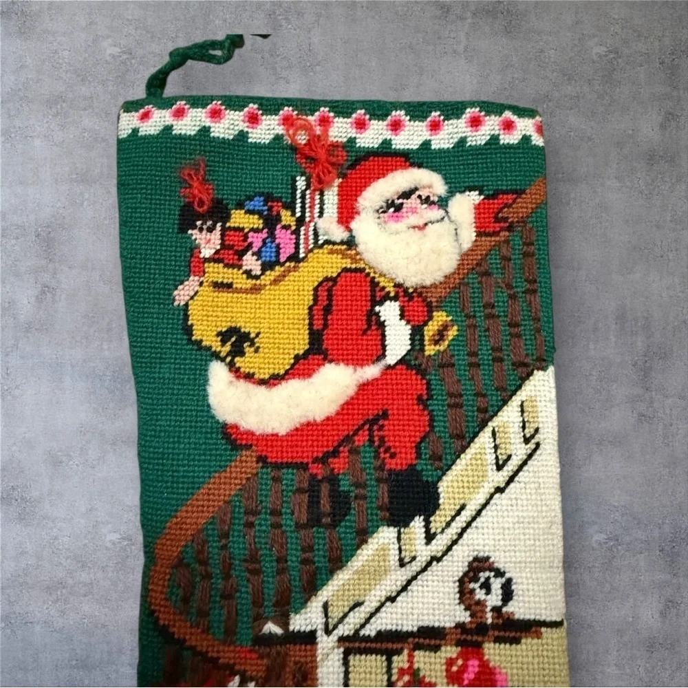 Vintage needlepoint Christmas stocking featuring design “Down The Bannister